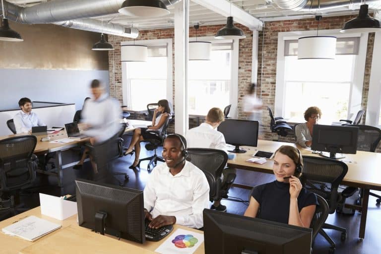 View Of Staff In Busy Customer Service Department